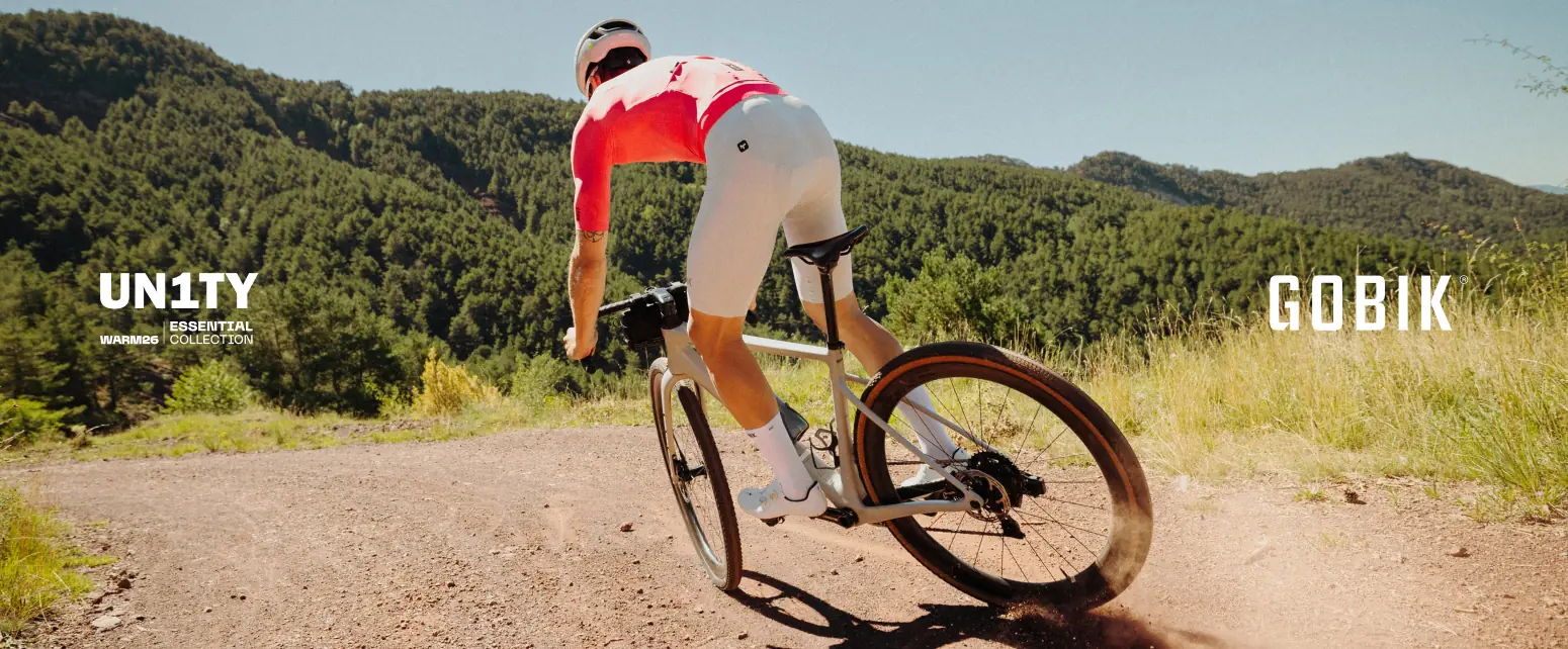 Rider in Gobik UNITY Essential kit on a gravel road
